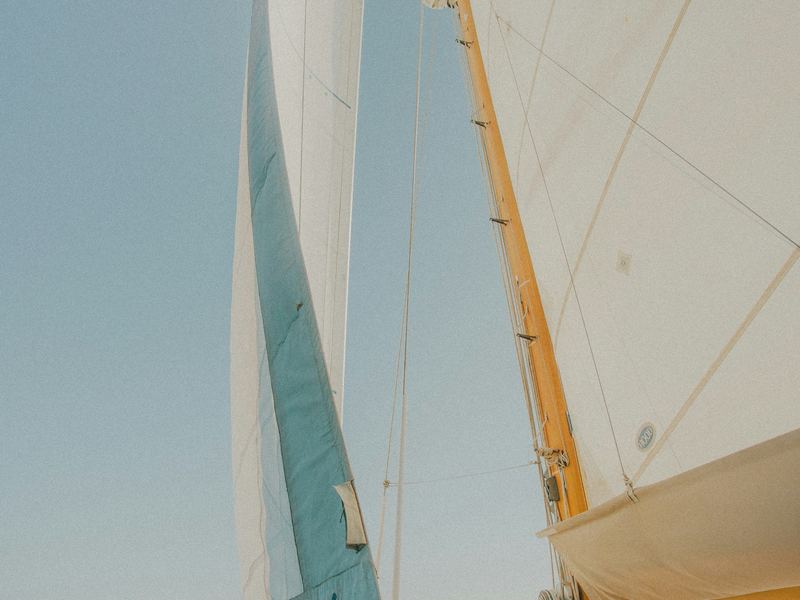 White sails of a yacht under way at sea